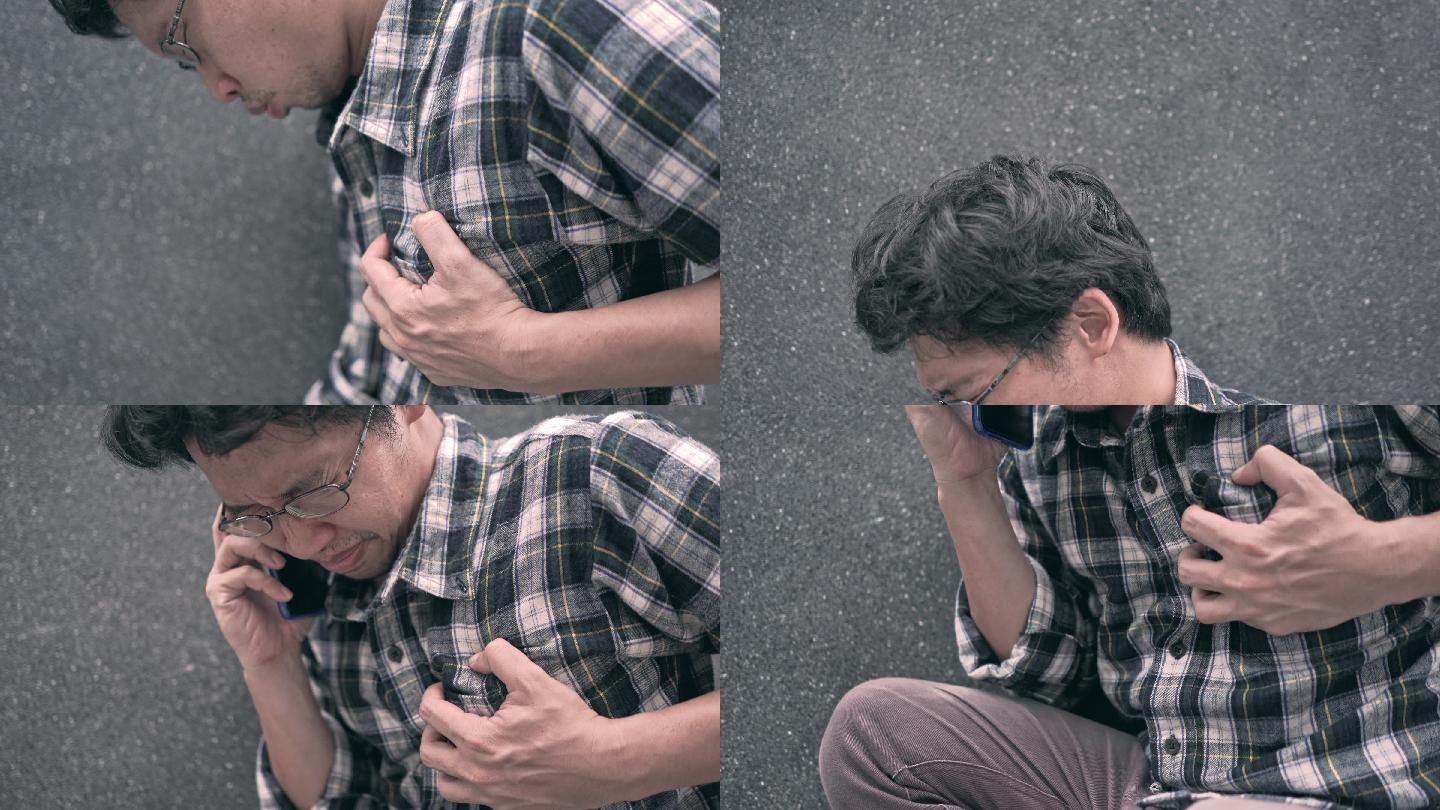 4K视频：心脏病发作的概念，一名男子在用手机拨打紧急电话时紧紧抓住胸部。