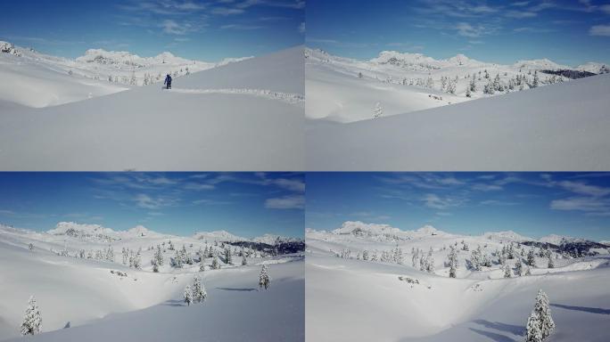 卡姆尼克-萨文加阿尔卑斯山，一名无人机登山者在新鲜的积雪中跋涉