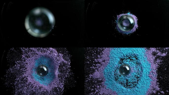 SLO MO LD玻璃球掉进一堆蓝色和紫色的灰尘中