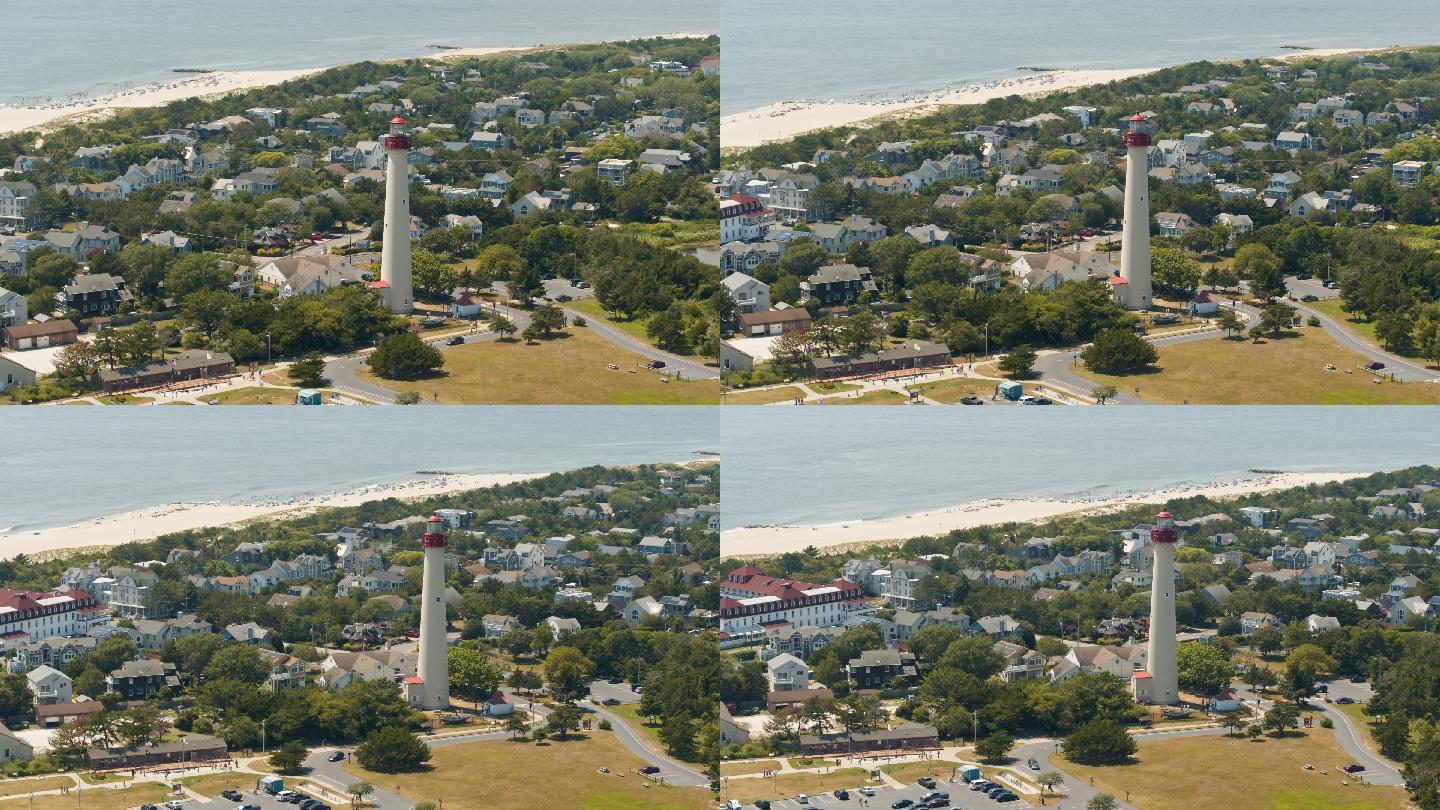 夏天阳光明媚的日子里，新泽西州五月角的灯塔。具有宽轨道平移相机运动的空中全景视频。
