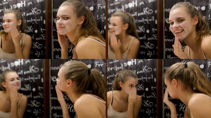 微笑的少女在浴室用肥皂洗脸