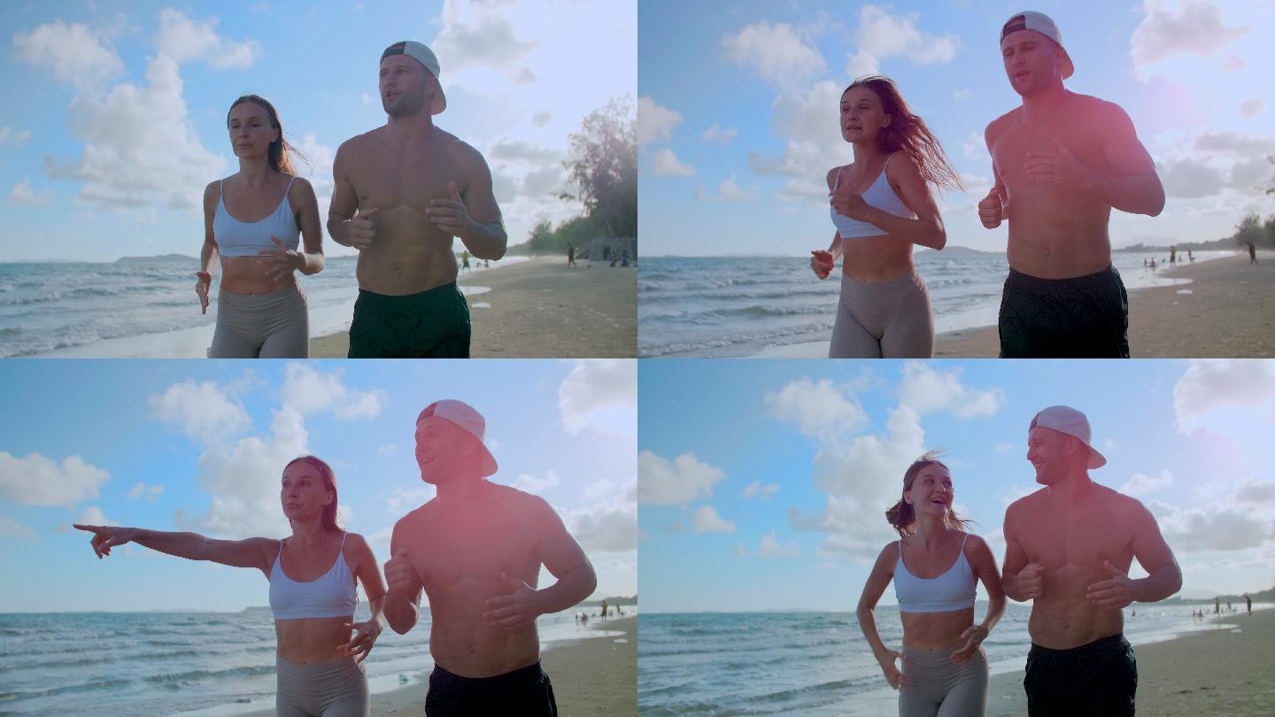 日落时分在海滩上慢跑的情侣