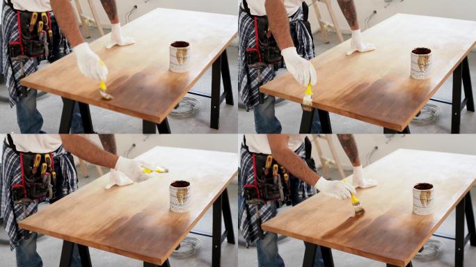 工匠画木桌刷油漆