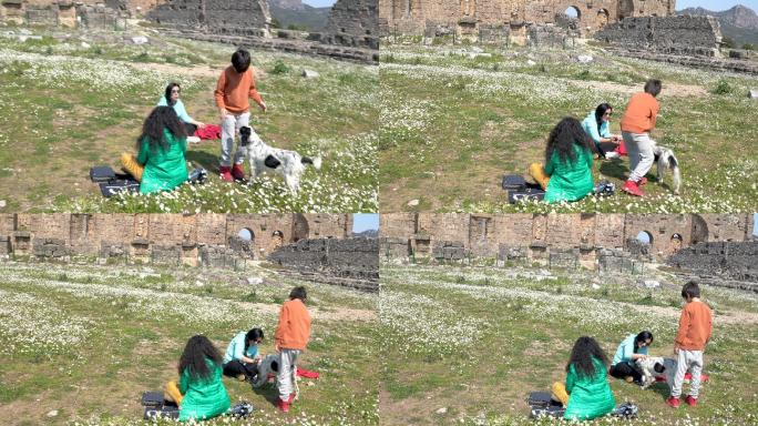 春天，一家人和宠物狗在古老的阿斯彭多斯玩得很开心的4K视频