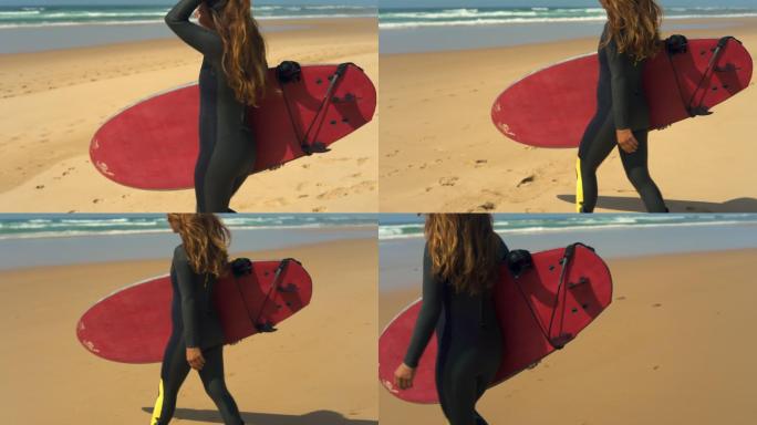 一个快乐的女孩拿着冲浪板在海滩上散步