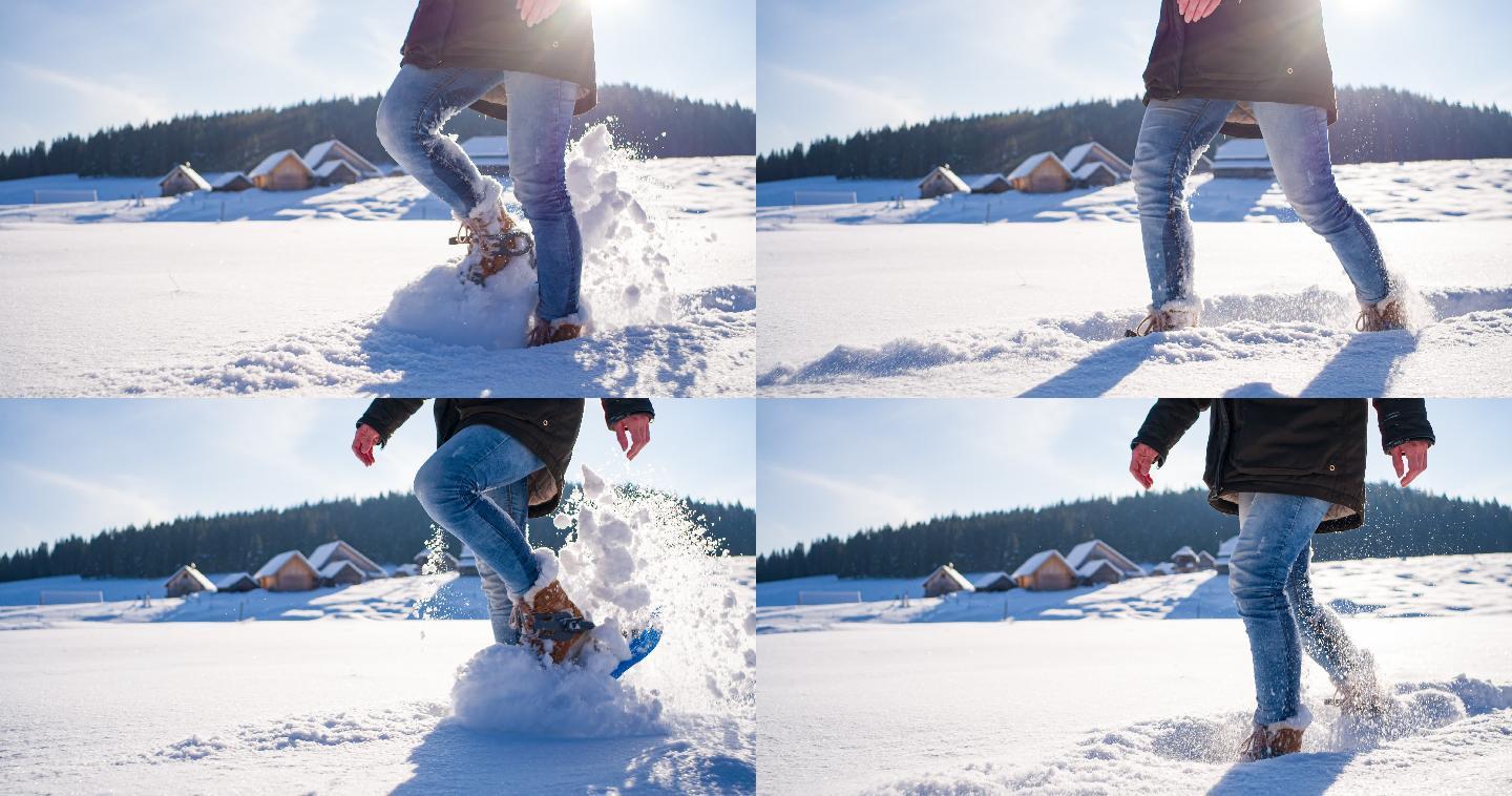 穿着雪鞋漫步在田园诗般的冰雪覆盖的冬季景观中