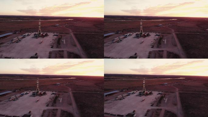 黎明或黄昏时分，在德克萨斯州西部或新墨西哥州东南部卡尔斯巴德附近的美国南部油田，从左到右的空中压裂油