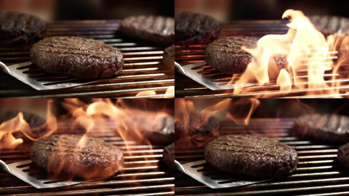 烧烤牛肉饼上的火焰超级慢镜头
