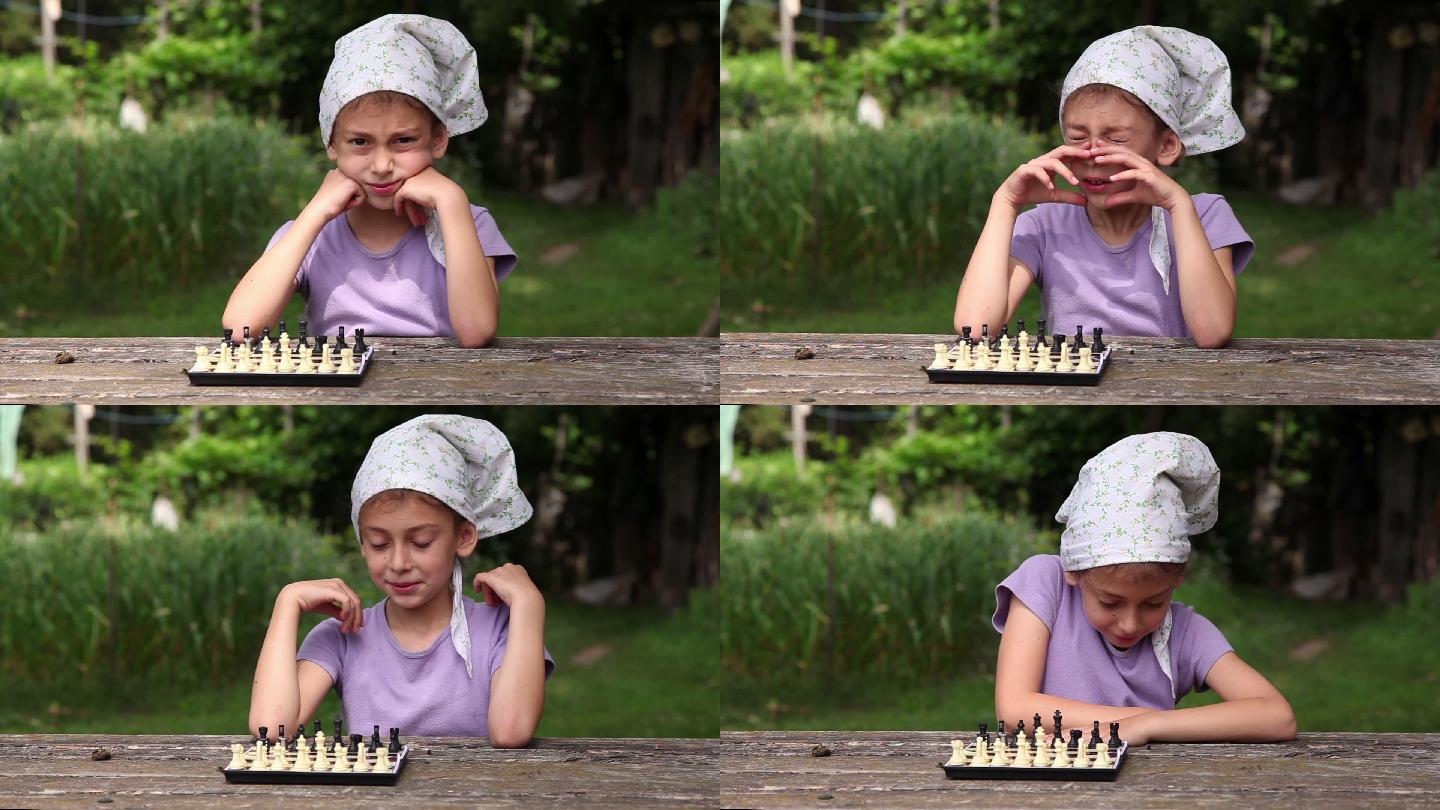 小女孩把棋子摆在棋盘上，等待比赛开始