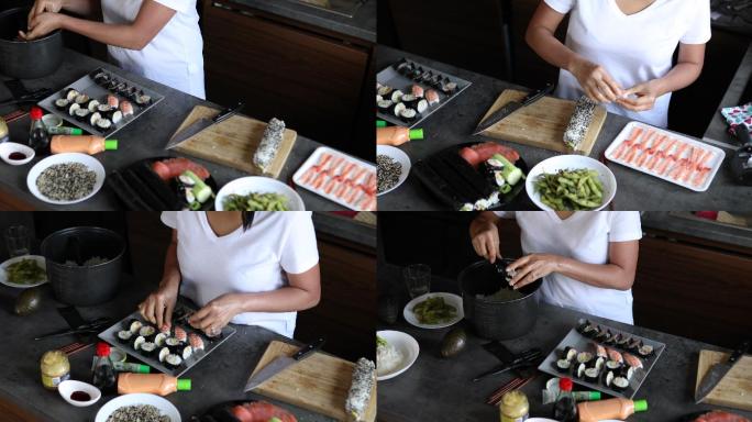一名泰国妇女在做饭团，并在盘子上摆放Nigiri寿司卷