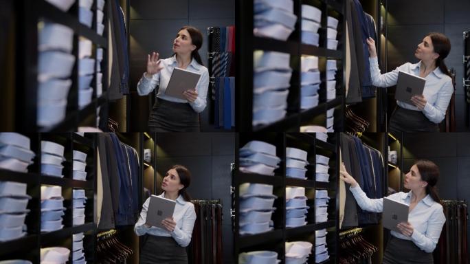 一家男装店的女经理用平板电脑盘点