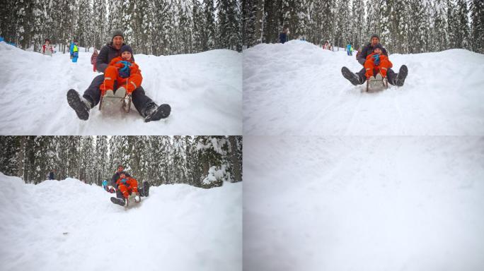 慢悠悠的父子滑下雪山，摔下来时哈哈大笑