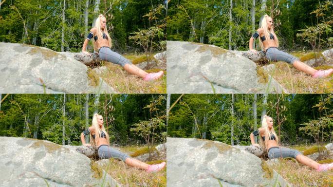 迷人的女性健身模特在山区户外做俯卧撑