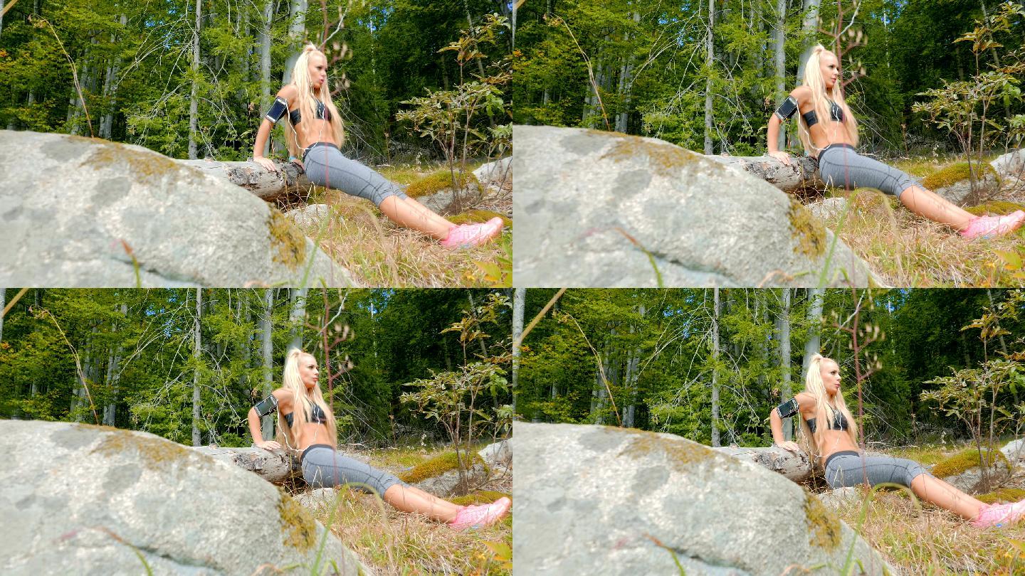 迷人的女性健身模特在山区户外做俯卧撑