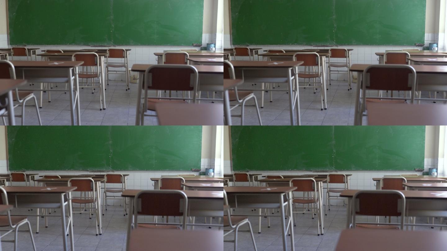 空荡荡的教室里，桌子被堵住，以保持社交距离。新法线