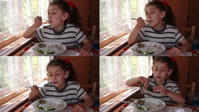 一个小女孩吃午餐的特写镜头