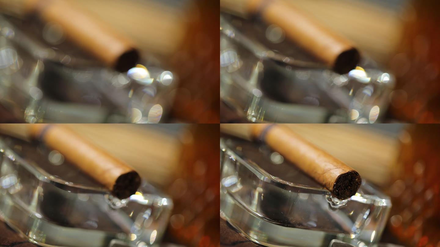 玻璃烟灰缸上的雪茄烟