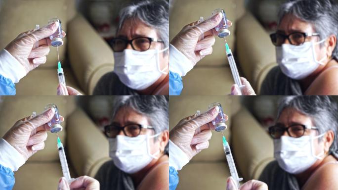 女医生在家为一位老年妇女接种疫苗