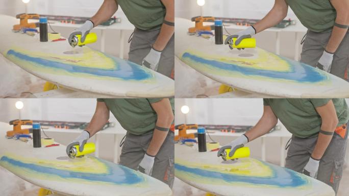 男子喷漆帆板冲浪板制作滑板制作冲浪板喷绘
