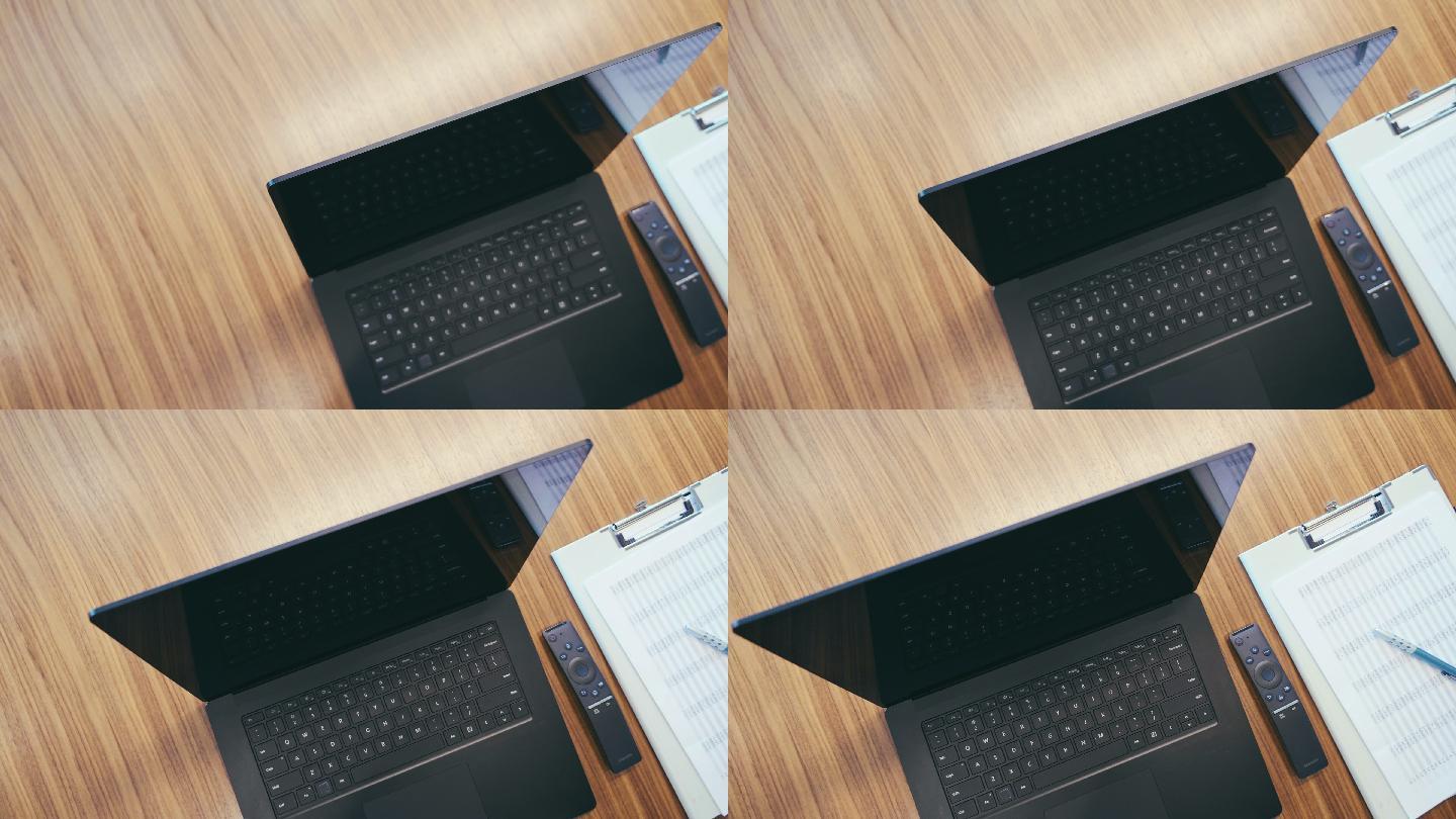空办公室办公桌上的笔记本电脑和剪贴板