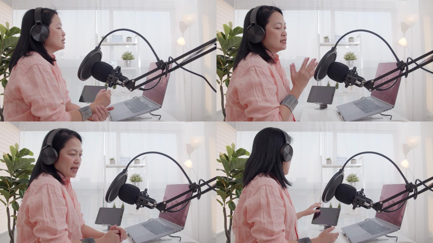 亚洲女性电台主持人用耳机和麦克风在笔记本电脑上录制播客。女播客在家里的工作室为在线节目制作音频播客。