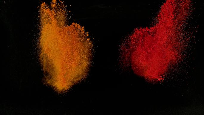 SLO MO LD橙色和红色粉末香料从黑色背景中爆炸出来