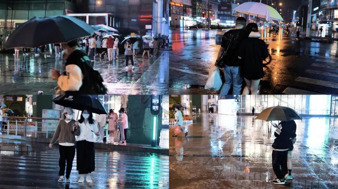 城市下雨夜晚雨中打伞过马路逛街人群