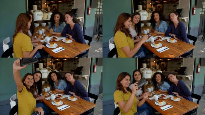 一群美丽的朋友在咖啡馆享受一个下午，一边自拍，一边聊天，一边吃零食
