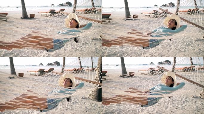 躺在海滩吊床上放松的女人