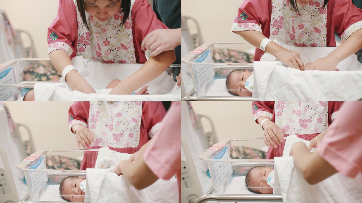 幸福亚洲家庭住院新生儿手持式照片