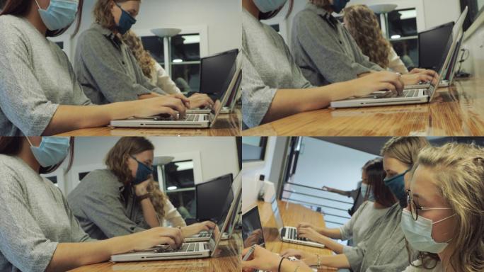 戴着口罩的大学生在计算机实验室一起工作设置4K视频