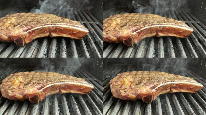厚切生调味牛肉里贝耶牛排和有机胡萝卜，炭火烧烤4K视频