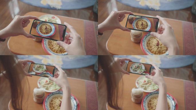 女子用手机拍照美食拍摄探店录视频