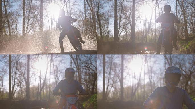摩托车越野赛骑手在森林小道上踩水坑