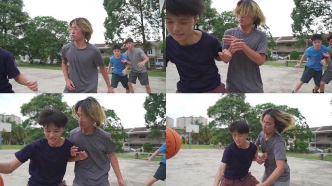 慢动作Z代亚裔中国少年在周末早上与朋友练习篮球比赛时挑战球员并投篮