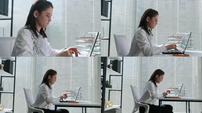 女商人在办公室的笔记本电脑上分析统计商业报告。