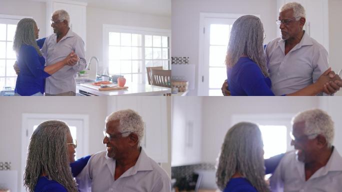 资深黑人夫妇在厨房做饭时跳舞