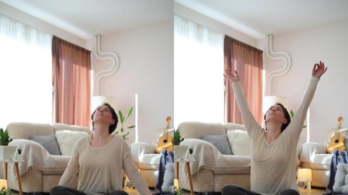 在公寓里练习瑜伽的女人。