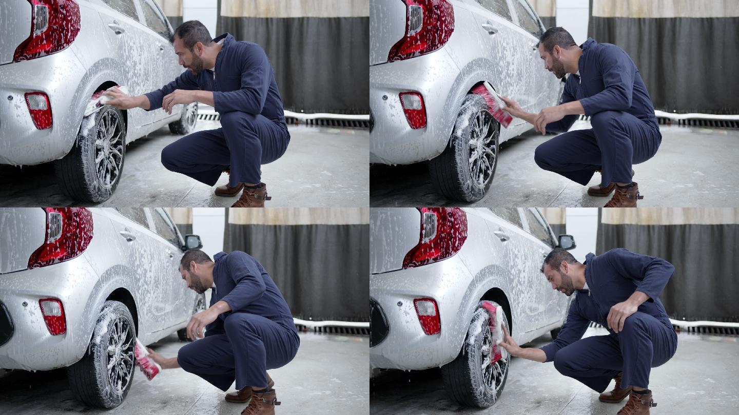 拉丁美洲蓝领工人在一家汽车修理店用肥皂扫帚清洁汽车轮胎
