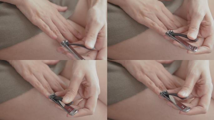 亚洲女性在家用指甲钳手工剪指甲