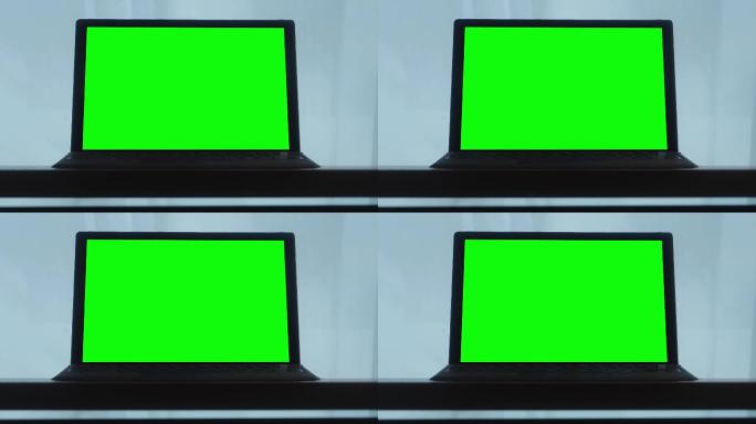 使用绿色屏幕的笔记本电脑，