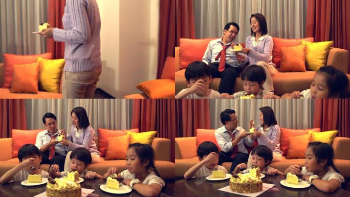 一个温暖的家庭坐在一起吃爸爸的生日蛋糕每个人都很高兴能在一起。它代表着爱和纽带，作为一个温暖的家庭团