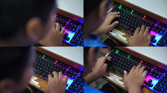 亚洲男孩使用键盘工作