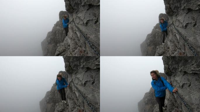登山者用锚链穿过垂直的悬崖