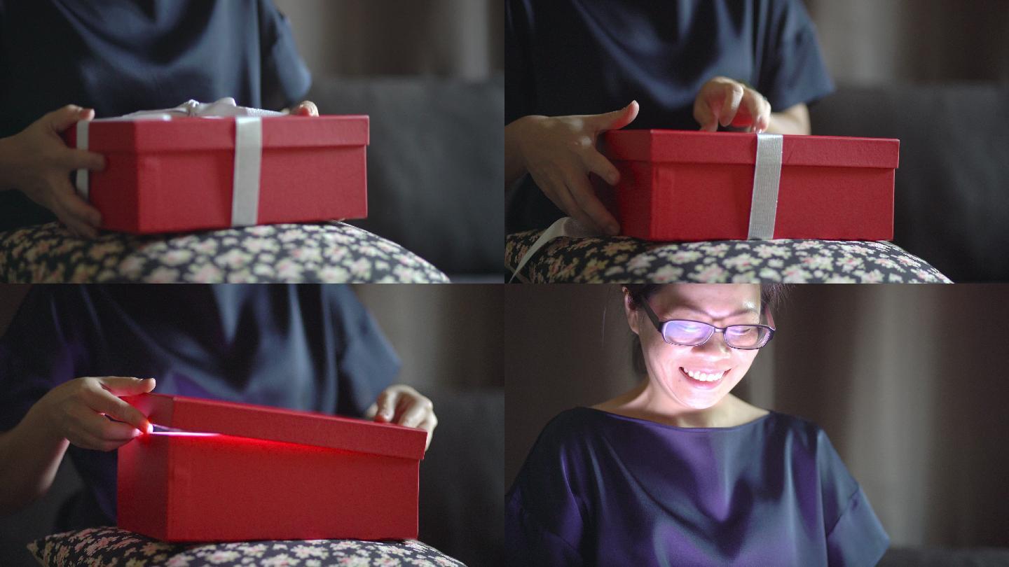 亚洲女性在家打开礼品盒