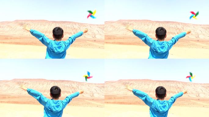 吐鲁番火焰山亚洲男孩玩风车