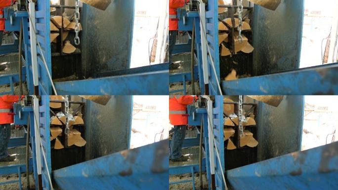 在锯木厂原木视频中用机器将原木切割成木板