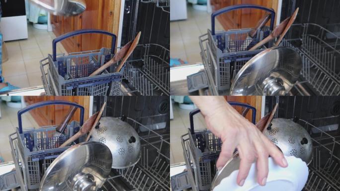 女人正在把脏盘子放进洗碗机里，双手特写