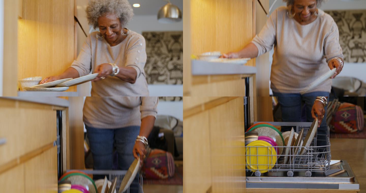 家中厨房使用洗碗机的老妇人