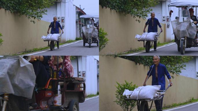 推独轮车的老人